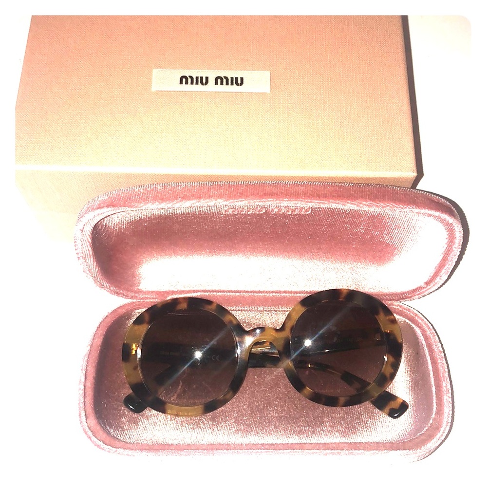 Sunglasses Miu Miu, Made in Italy.